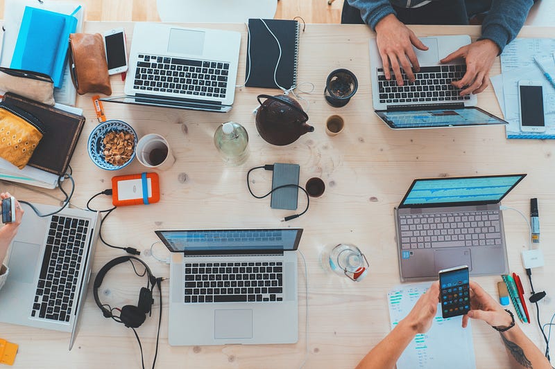 A programmer focused on coding at their desk