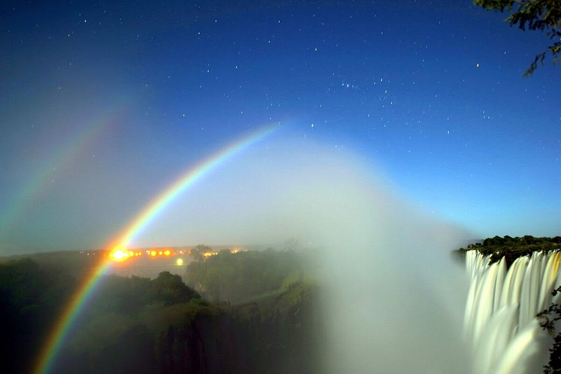 Captivating moonbow over a waterfall