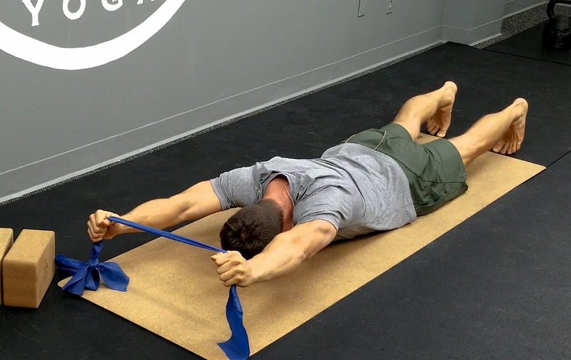 Prone Y pattern exercise with resistance band