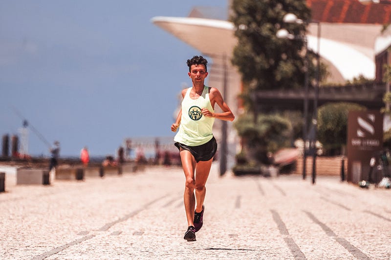 Runner practicing strides on a track