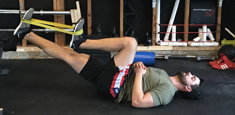 Performing lying psoas march exercise